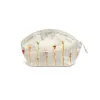 Cosmetic bag raw silk embroidered.
